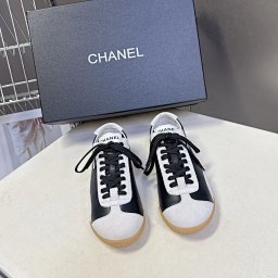 CHANEL Black White Low-Top Leather Sneakers